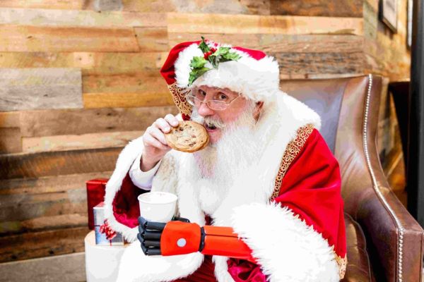 man in Santa suit with red prosthetic arm
