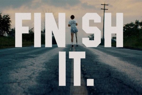 Terry Fox running on road with text overlay FINISH IT